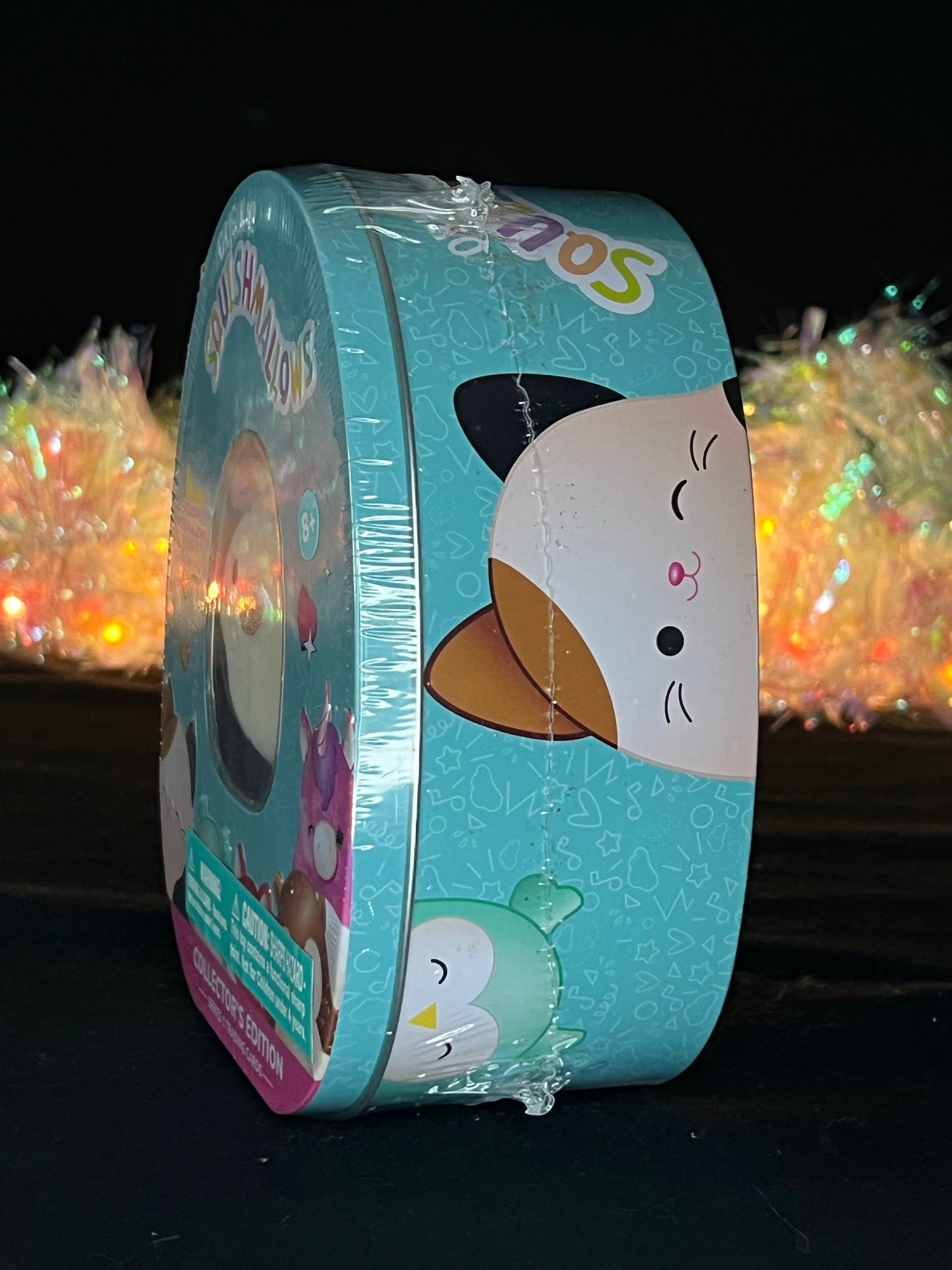 Squishmallow Collector’s Tin: Connor the Cow Sweet Magnolia Charms